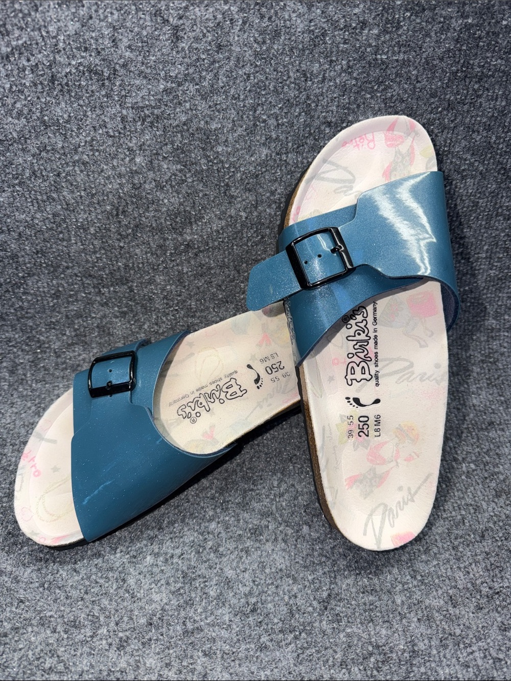 Birki's by Birkenstock Catalina slide sandals in a blue patent finish